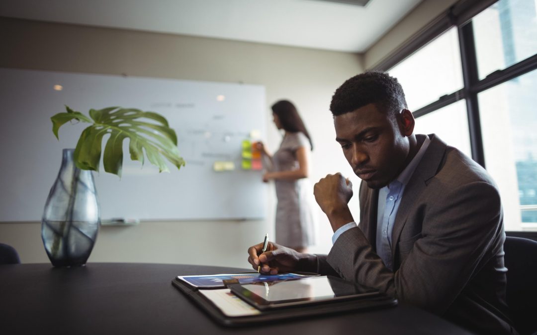 Businessman using a digital tablet for self-development