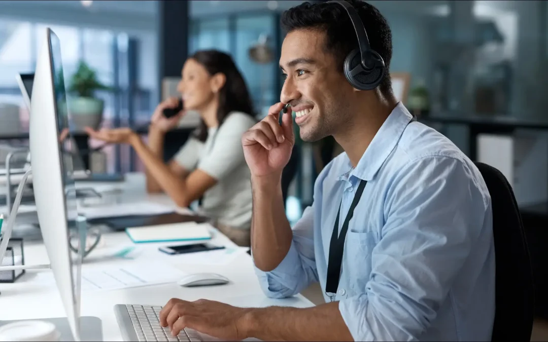 Smiling customer service representative assisting a happy customer in a professional setting.